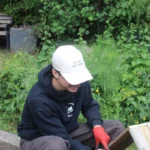 Wearing the cream cap at a build day