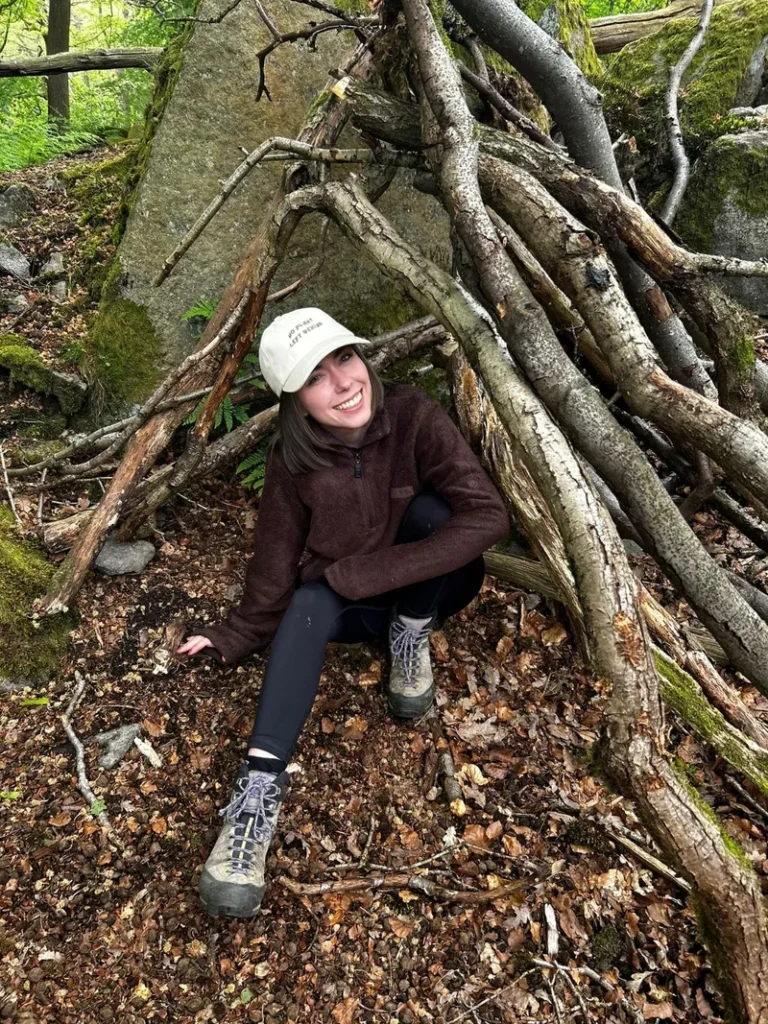 Wearing the cream cap in a woodland den
