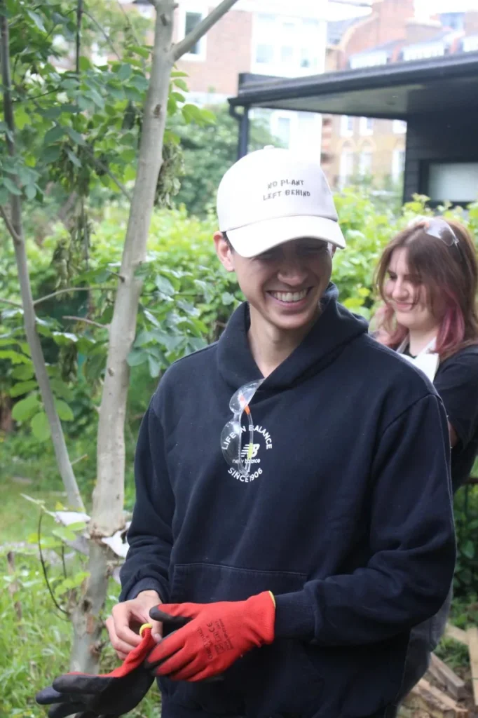 Wearing the cream cap at a garden volunteering day