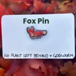 The fox pin on its backing card