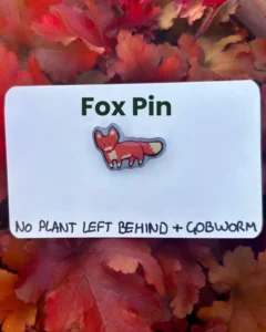 The fox pin on its backing card