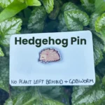 The hedgehog pin on its backing card